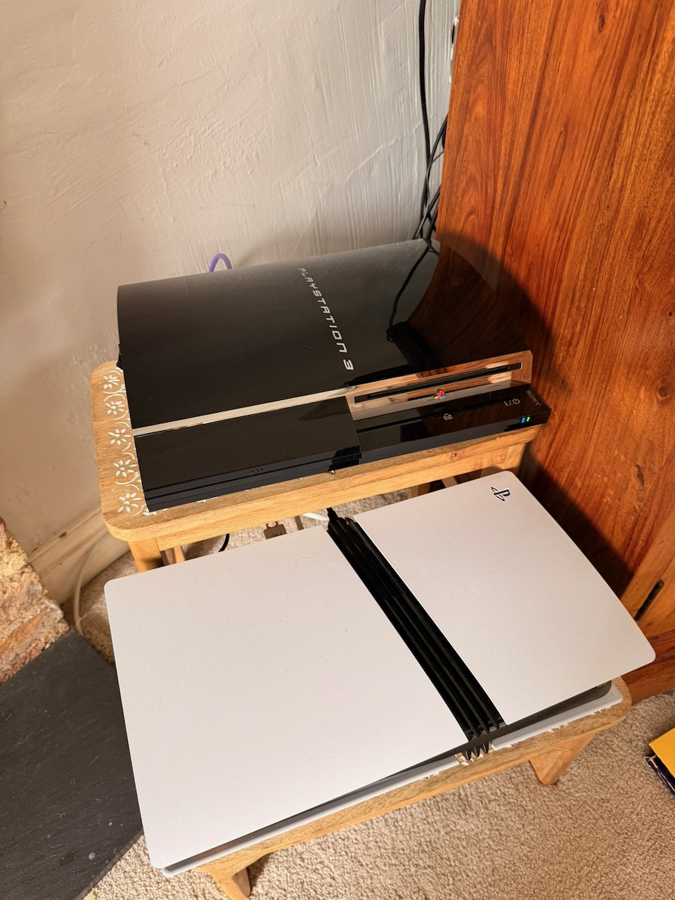 PS3 back in its spot, stacked above the PS5